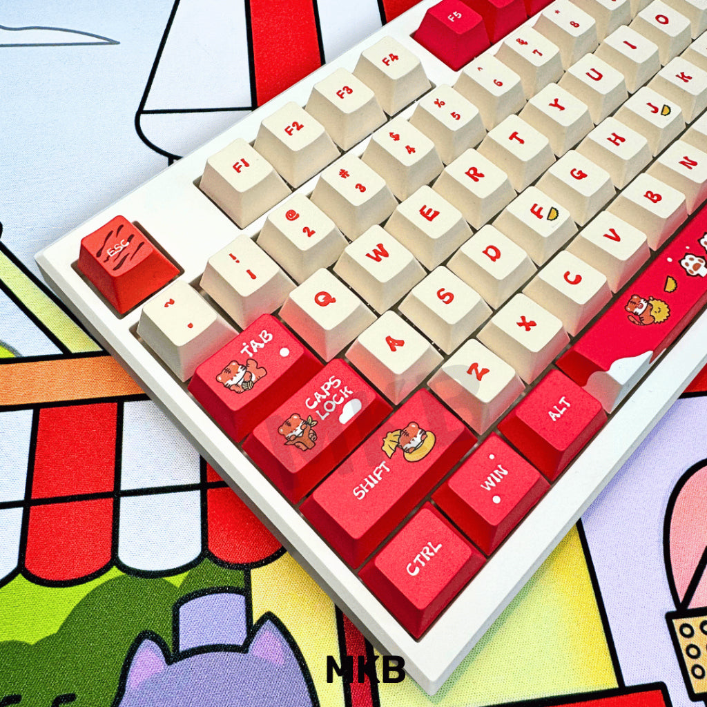 MKB Tora Keycaps on a backlit keyboard, revealing the stunning contrast of red, black, and white keycaps under glowing RGB lighting.