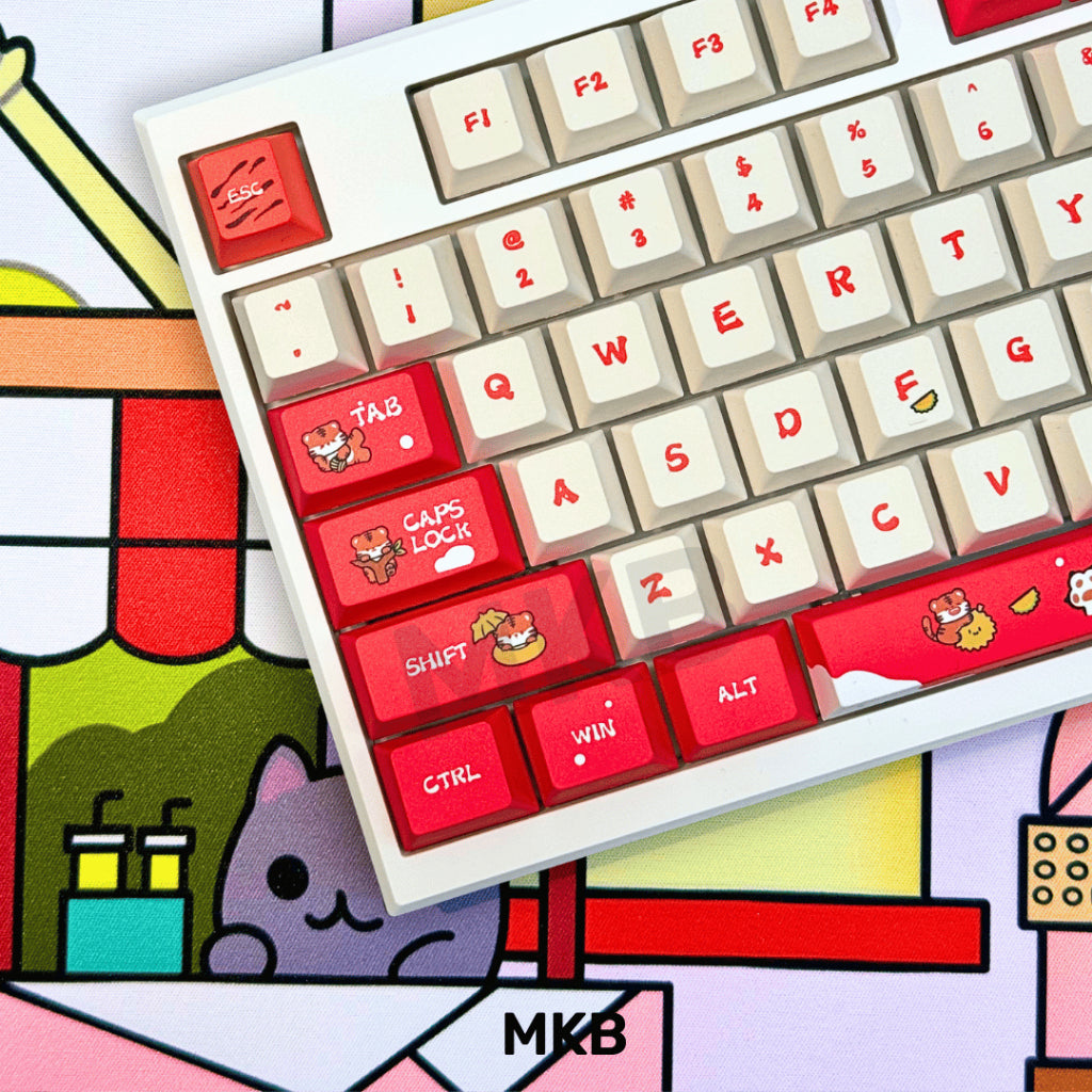 MKB Tora Keycaps installed on a mechanical keyboard, showcasing the bold red, black, and white colorway with side-printed legends.