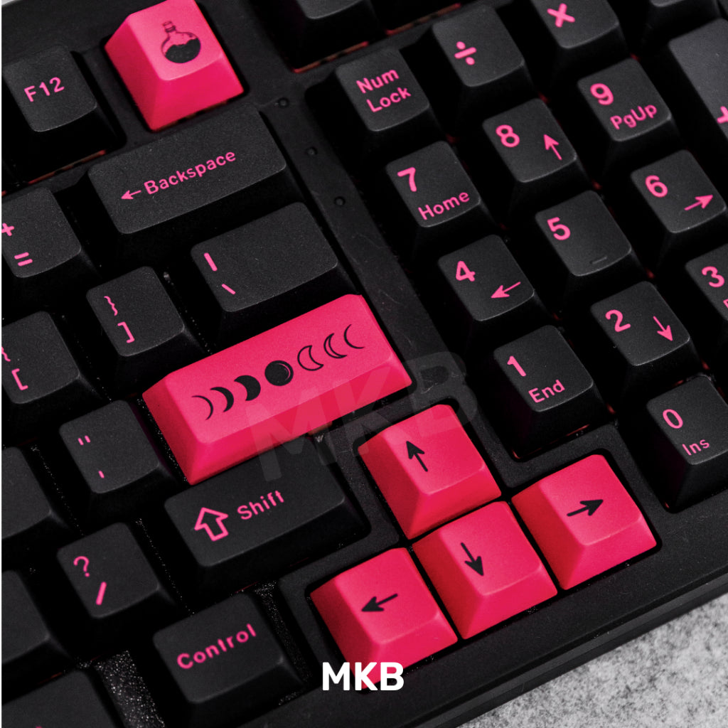 Black and pink keycaps on keyboard, neon pink colour on arrow and enter key.