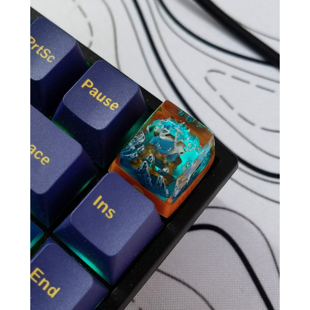 Pokemon Blastoise artisan keycap on a RGB keyboard